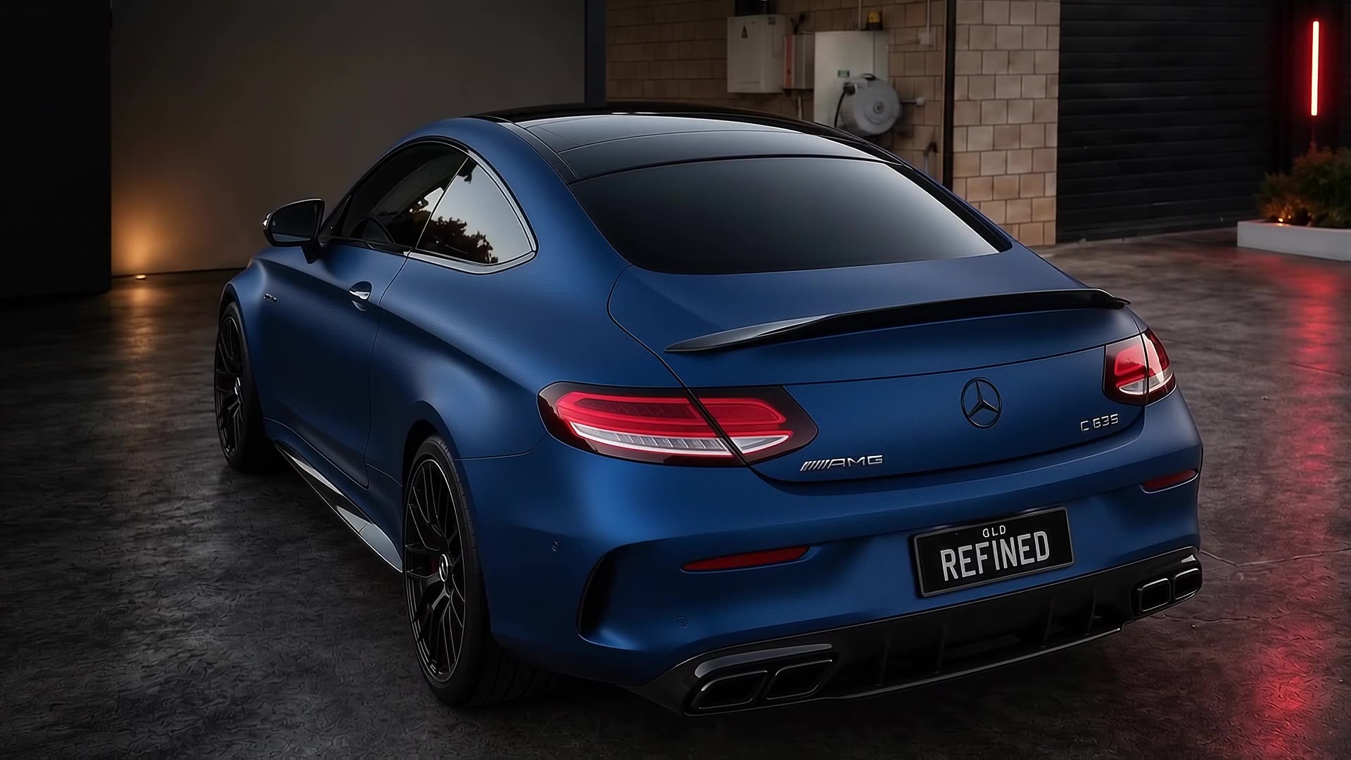 Matte blue Mercedes-AMG coupe with a REFINED number plate, parked in a garage, camera orbiting from the rear to the front