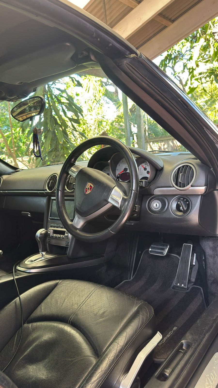 Clean sports car cockpit with dashboard and steering wheel detailed